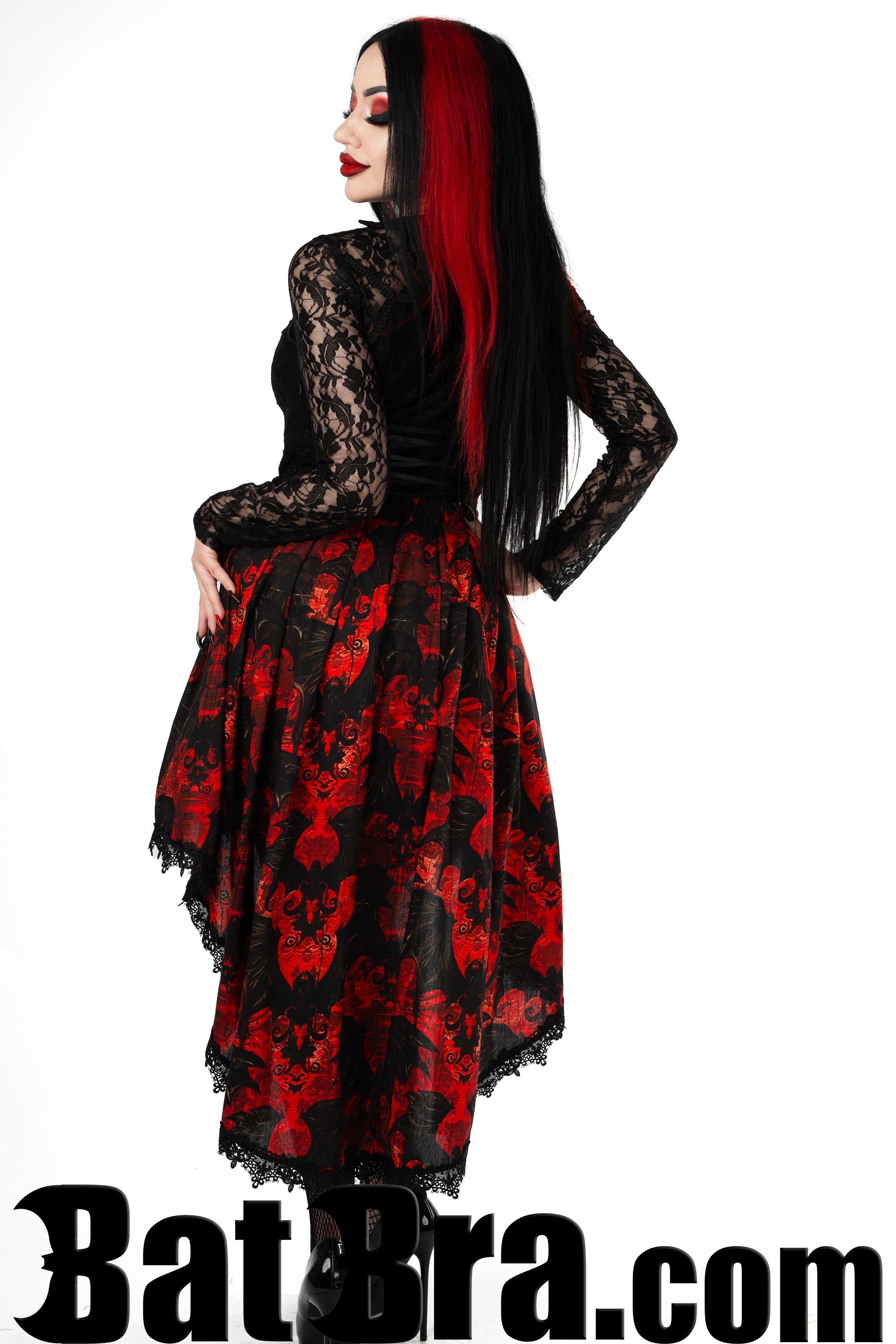 Back view of women's printed back design asymmetrical skirt showing the longer back and black lace trim
