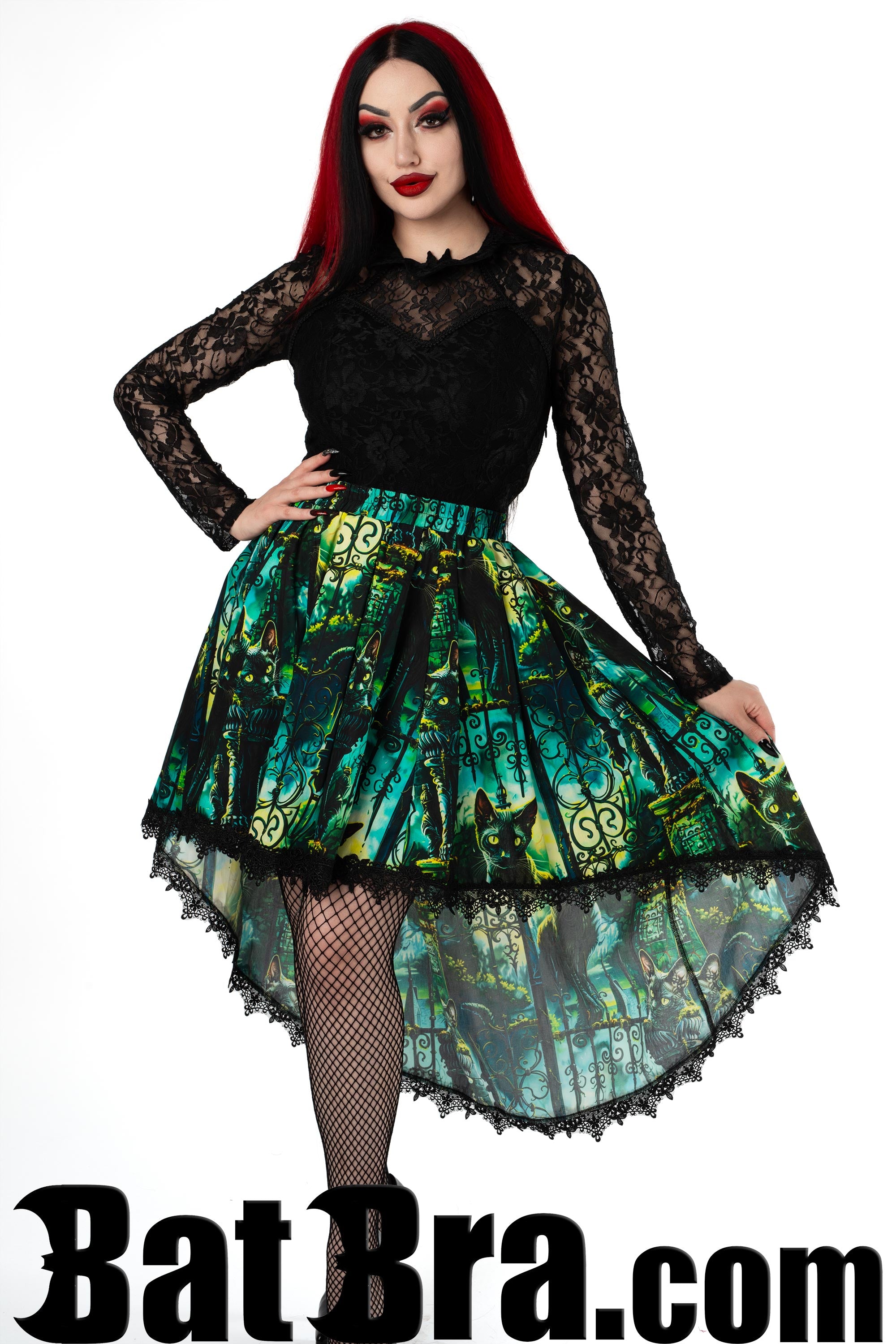 Women's asymmetrical high low skirt in green blues and yellows featuring a print with cute cats