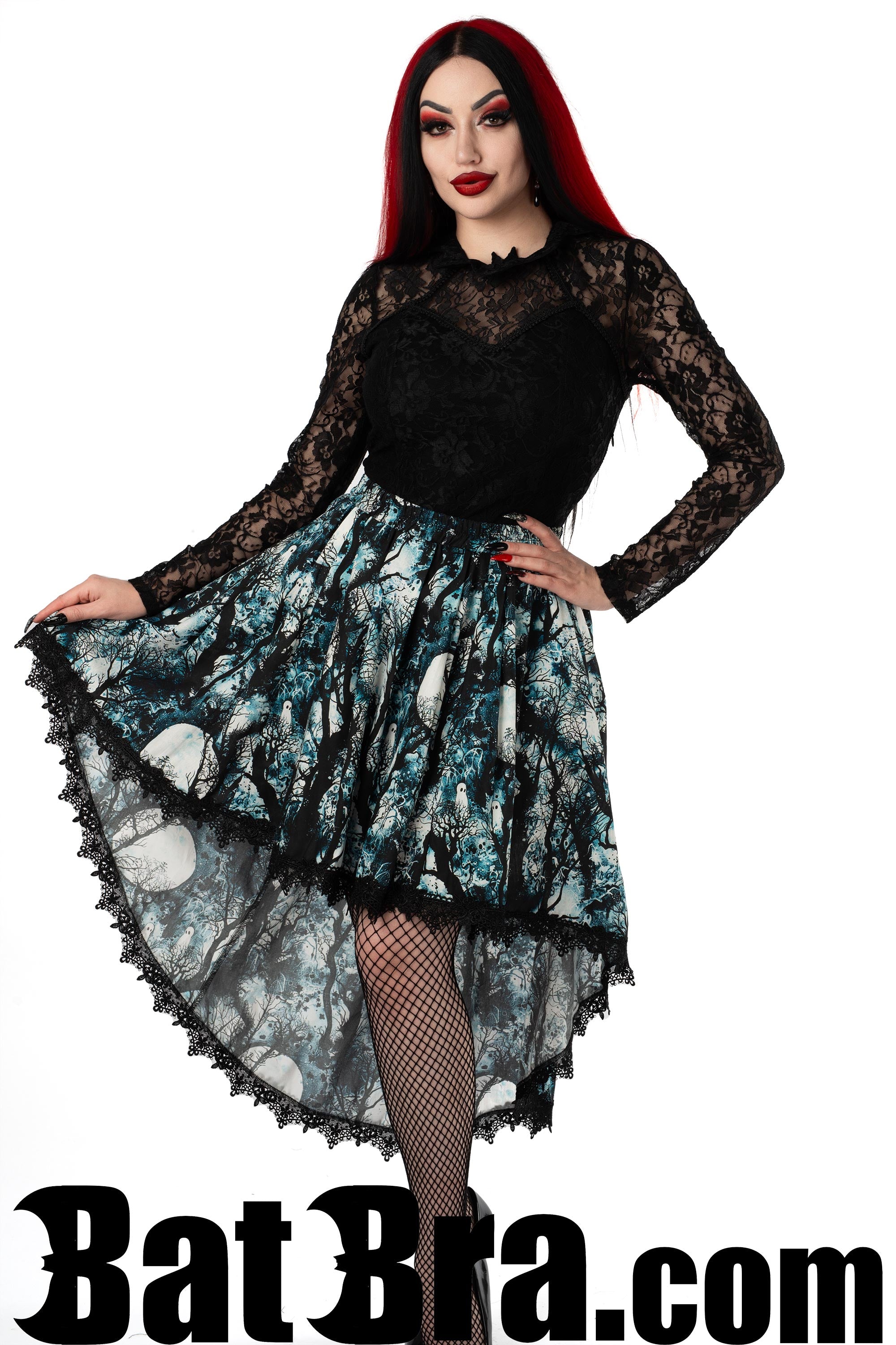Women's asymmetrical skirt featuring forest and full moon print in a light blue colour and with black lace hem 