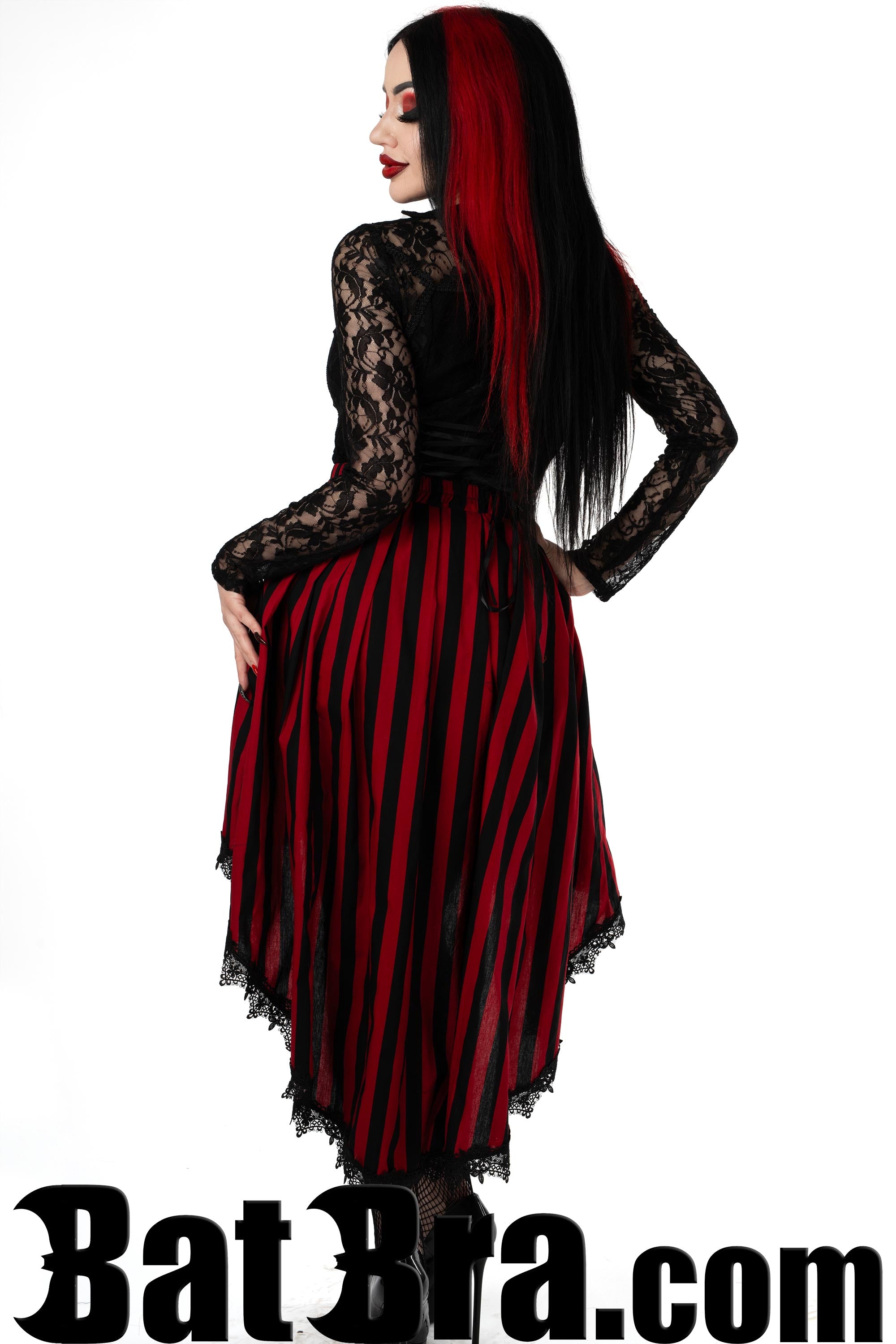Back view of women's red and black striped asymmetrical skirt with pretty black lace trim hem
